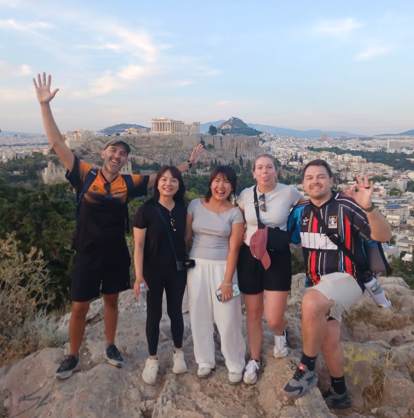 George, the Athens tour leader, with a happy small group of guests, the Acropolis behind them
