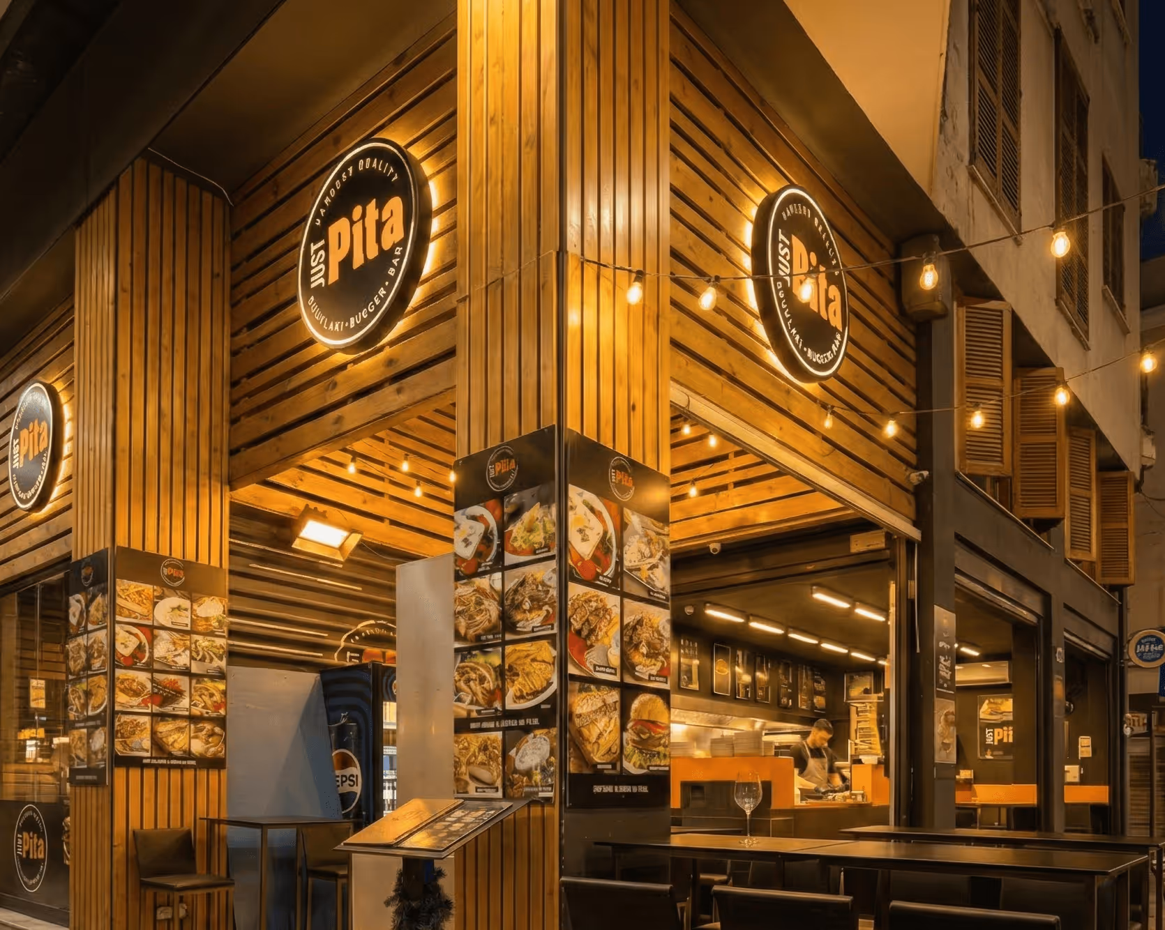 Just Pita souvlaki shop on Athinas Street, Athens — storefront with menu boards